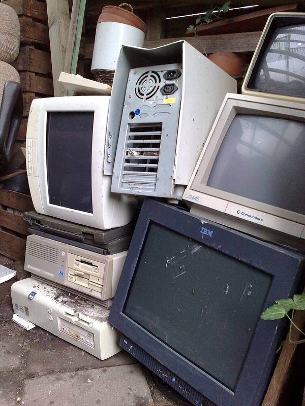 A pile of discarded electronics and circuit boards