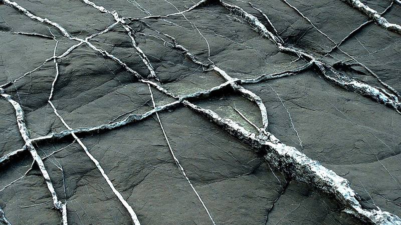 A white quartz vein cutting through rock